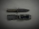 a knife and a screw on a gray surface
