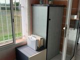 a refrigerator and a freezer in the corner of a room