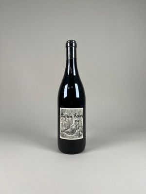 a bottle of wine that is sitting on a table