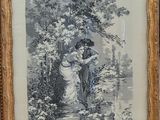 an old picture of a woman and child in a wooded setting