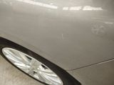 a close up of a car ' s front wheel and tire