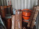 a pile of boxes and other items in a storage area