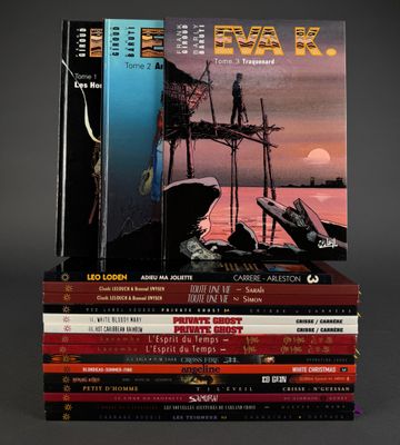 many books stacked on top of each other on a table