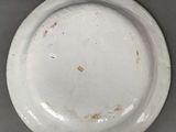 a white plate that is sitting on top of a table
