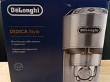 packaging of delonghi delica style coffee maker on a wooden table