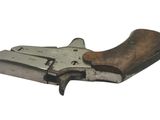 a close up of a gun with a wooden handle on a white background