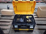 a yellow tool box with tools in it on a pallet