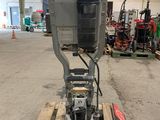 an image of a machine that is sitting on a pallet in a warehouse