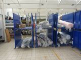 a room filled with lots of blue bins and boxes