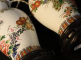 two vases that have been decorated with flowers on them