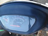 a close up of a motorcycle with a speedometer on it