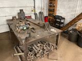 a workbench that has a bunch of tools on it