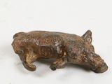 bronze figurine of a boar on a white background