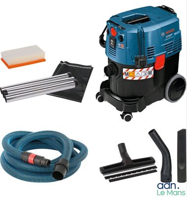 un gros plan d'un aspirateur muni d'un tuyau et d'un aspirateur