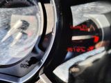 a close up of a car dashboard with a speedometer