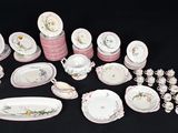 many different types of plates and bowls on the table