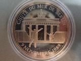 the coin is in a clear plastic container on a table