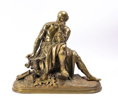 an antique bronze statue of a man sitting on a rock with a dog