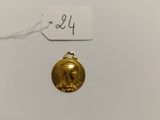 a gold bell ornament on a white background with a price tag