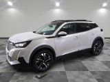 a white toyota c - hr suv parked on a checkered floor