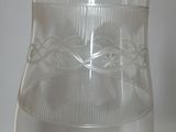 a clear glass vase with water in it on a table