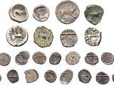 an image of a collection of ancient roman coins on a white background