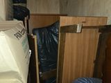 many boxes stacked on top of each other in a room