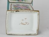a small box with a picture on it sitting on a table