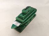 a small green toy boat on a white surface