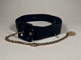 the belt is black and has a gold chain on it