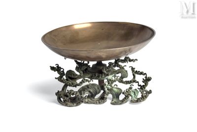 a metal bowl with a dragon design on it