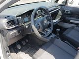 dashboard of a car with a steering wheel and dashboard controls