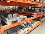many different types of metal parts on the shelves