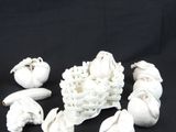 a bunch of white birds that are sitting in a basket