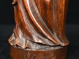 bronze statue of a woman holding a baby in her arms