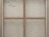 an old picture of a window with a message written on it