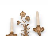 two candles that are sitting on a wall