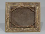 an old wooden picture frame with a square design in the middle
