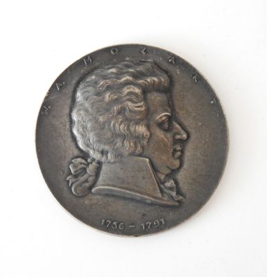 a coin with a portrait of a man on it