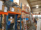 a room with a lot of boxes and ladders