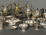 a lot of silver items that are on a table