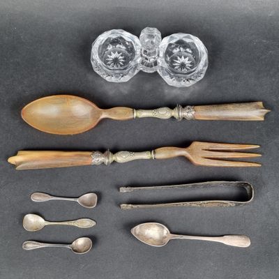 an assortment of silverware including spoons, forks, and glasses