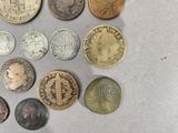 a lot of coins that are on the table