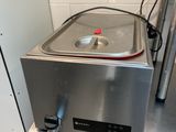 a machine that is sitting on a counter in a kitchen