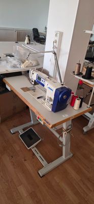 a sewing machine sitting on a table in a room