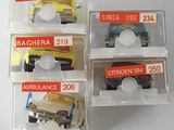 four plastic boxes with different types of toy cars in them