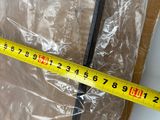 a measuring tape that is on top of a piece of plastic