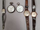 several different types of watches are lined up on a white surface