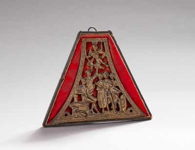 an image of a red and gold triangle shaped object on a white surface