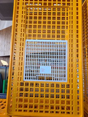 a yellow plastic crate with a blue sign on it